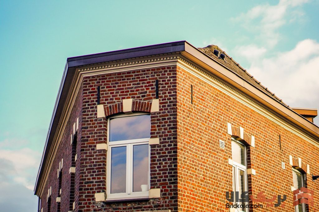 اهمیت مقاومت شیمیایی در مصالح ساختمانی - low angle shot apartment building sunlight daytime تفاوت مقاومت شیمیایی با مقاومت مکانیکی در آجر